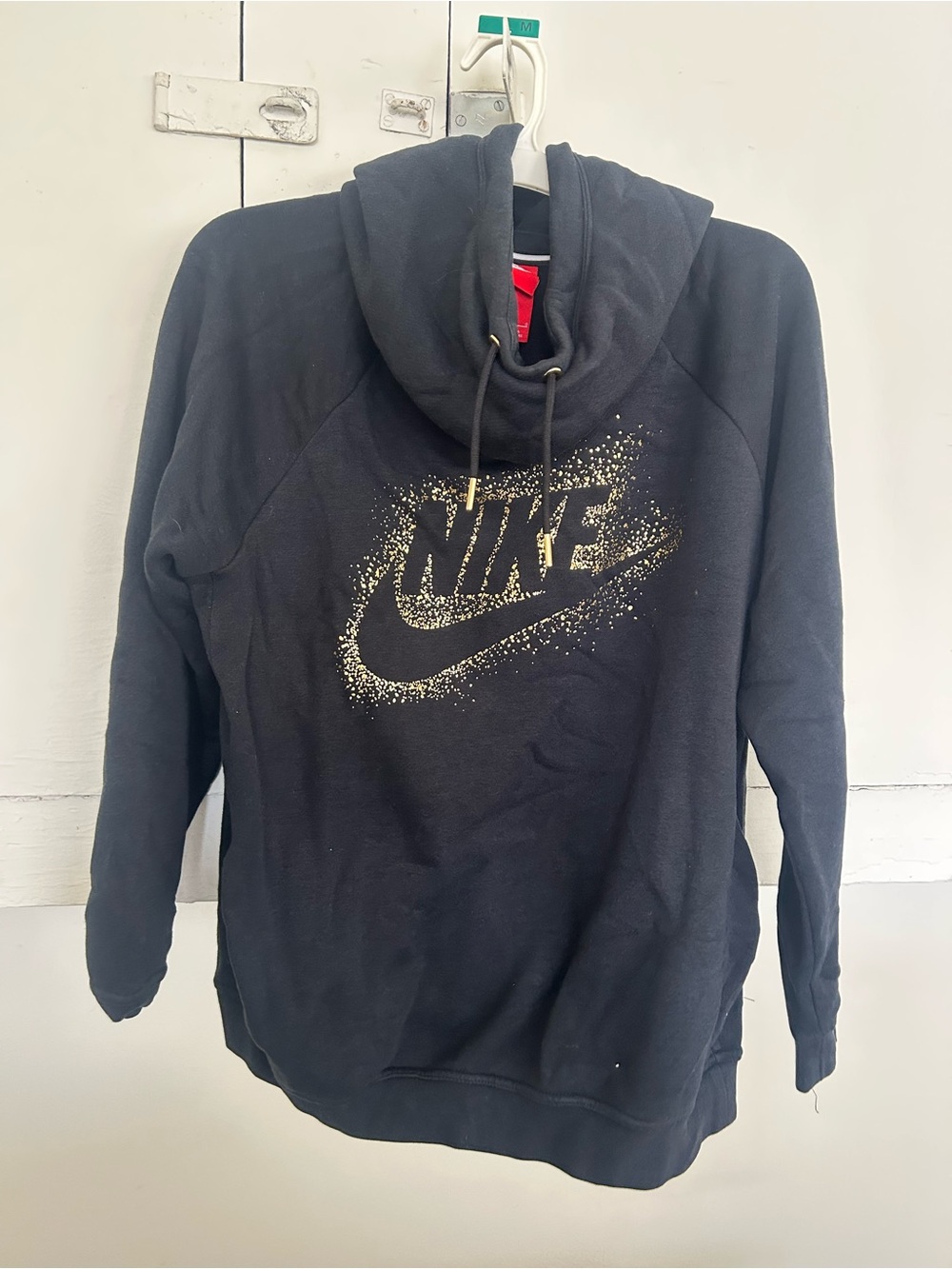 Nike Black Hoodie with Gold eyelets and design